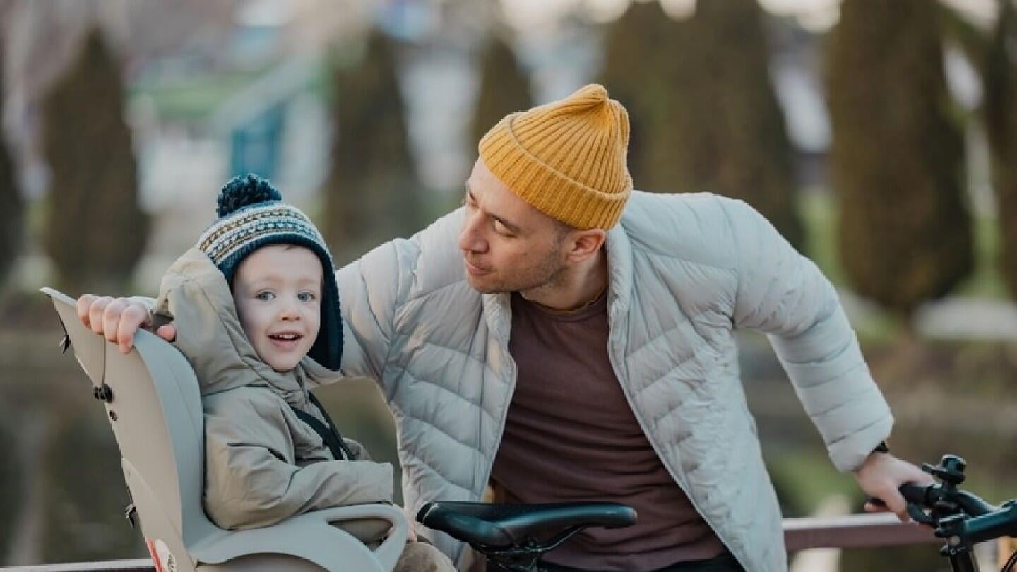 Nikola with his child Josif in the City Park - January 2025, Skopje, North Macedonia.  Photo credit: UNFPA North Macedonia_Ognen Aceski